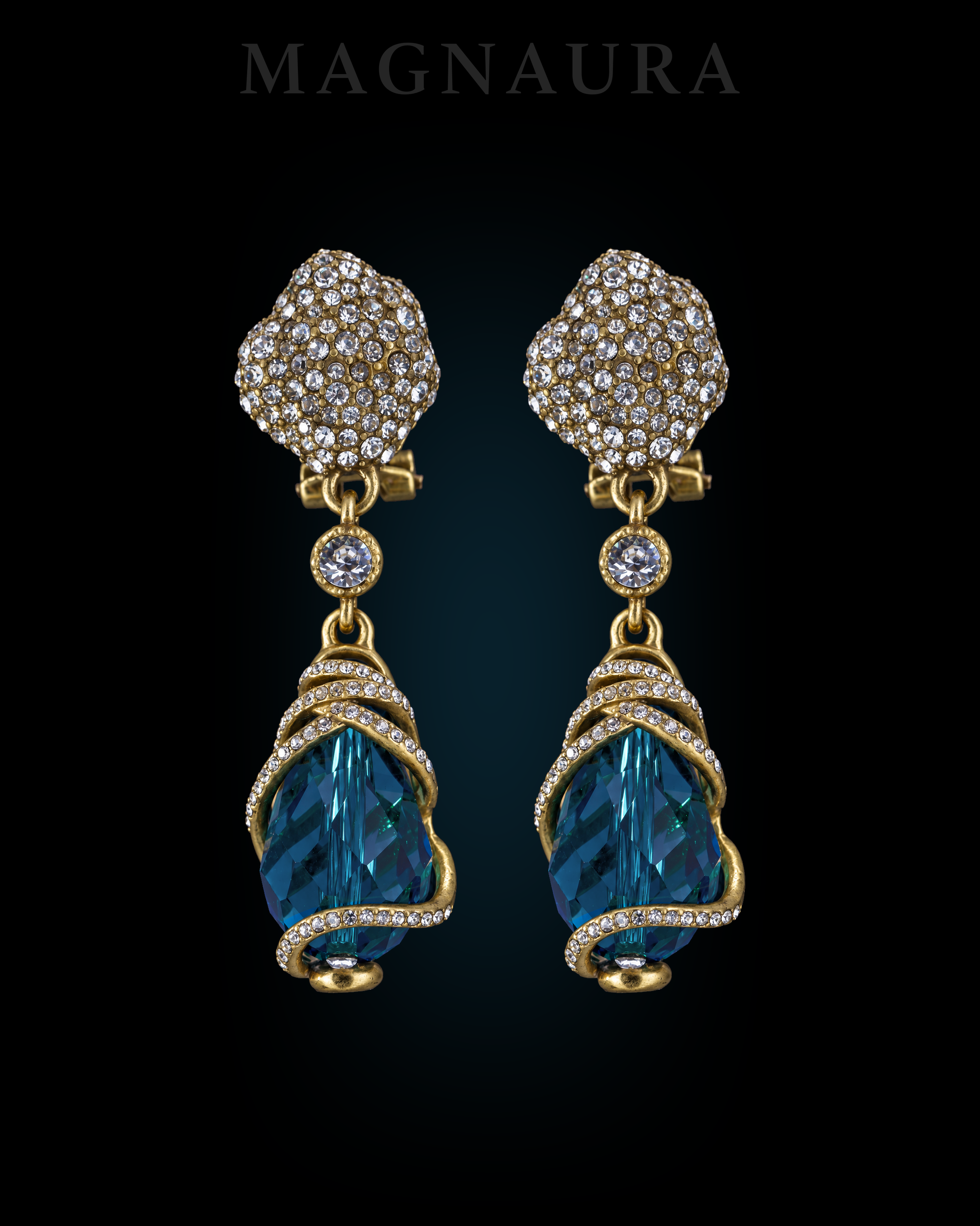 A pair of The Lagoon Spiral Drops with peacock-blue drops and gold-tone spiral bands on a dark background