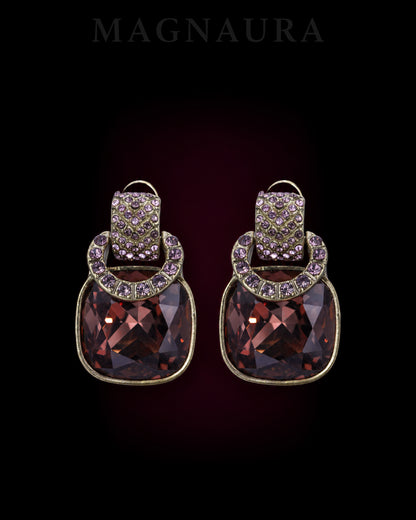 MAGNAURA The Cognac Crescent Studs, a matching pair with wine-brown cushion-shaped glass and purple accents.